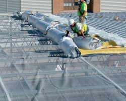 6. Performance, Protection, Possibilities roofing crew installing a roof
